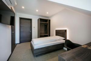 Postel nebo postele na pokoji v ubytování Hotel Spitzerberg by b-smart
