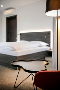 Postel nebo postele na pokoji v ubytování Hotel Spitzerberg by b-smart