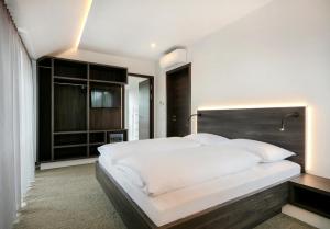 Postel nebo postele na pokoji v ubytování Hotel Spitzerberg by b-smart