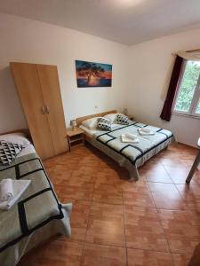Postel nebo postele na pokoji v ubytování Villa Brasina
