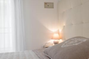 A bed or beds in a room at B&B Airone Cervia - Camere e Appartamenti