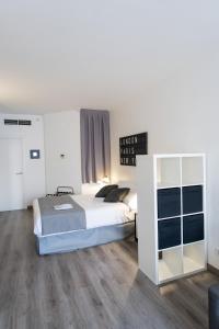 Posteľ alebo postele v izbe v ubytovaní Aparthotel Atenea Calabria