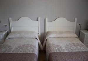 Postel nebo postele na pokoji v ubytování Hostal Casa Jose