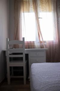 Postel nebo postele na pokoji v ubytování Hostal Casa Jose