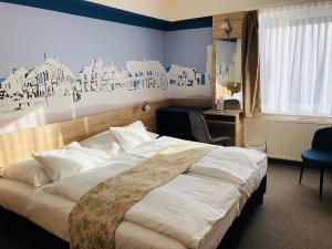 Posteľ alebo postele v izbe v ubytovaní Hotel Irottkö