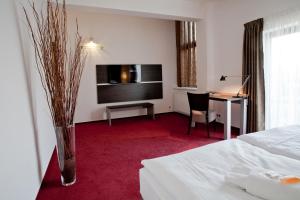 Postel nebo postele na pokoji v ubytování Hotel Zámecká Sýpka