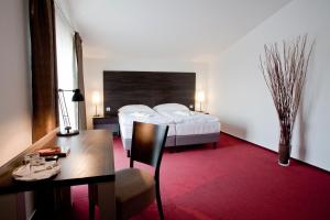 Postel nebo postele na pokoji v ubytování Hotel Zámecká Sýpka