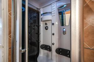 a metal elevator in a room at Colonna Suite - Rome Termini Station Big Apartment in Rome