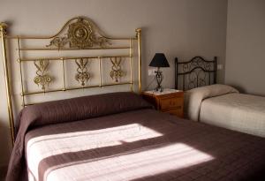 Postel nebo postele na pokoji v ubytování Hostal Casa Jose
