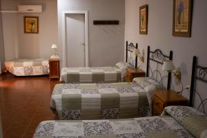 Postel nebo postele na pokoji v ubytování Hostal Casa Jose
