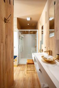 a bathroom with a white counter and a shower at Luxurious by Sebastiana Group in San Sebastián
