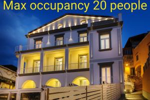a large white house with the words max occupancy people at Palazzo Murrano - Adults Only in Vico Equense