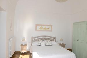 Ένα ή περισσότερα κρεβάτια σε δωμάτιο στο Casa Positamo