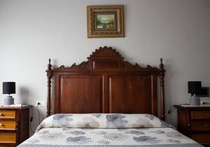 Postel nebo postele na pokoji v ubytování Hostal Casa Jose