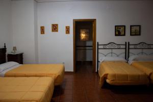 Postel nebo postele na pokoji v ubytování Hostal Casa Jose