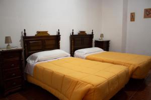 Postel nebo postele na pokoji v ubytování Hostal Casa Jose