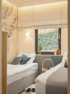 Krevet ili kreveti u jedinici u objektu Apartament Nadmorski z ogródkiem i sauną