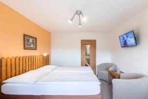 Postel nebo postele na pokoji v ubytování Hotel Rusava