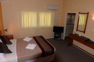 Postel nebo postele na pokoji v ubytování Classic Motel
