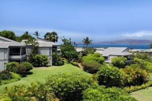 an aerial view of a house with a yard at Wailea Ekolu Village - CoralTree Residence Collection in Wailea