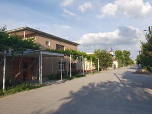 an empty street with a building on the side at HOTEL APOLLON in Samarkand