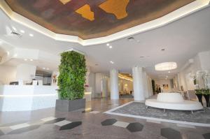 a lobby with a large painting on the ceiling at Hotel Excelsior San Marco in Bergamo