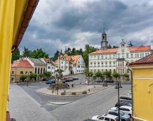 a view of a town with a clock tower at Penzion Růže in Benešov nad Ploučnicí