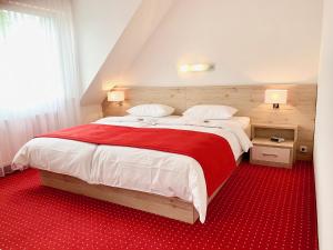 Postel nebo postele na pokoji v ubytování Hanse Hotel + 31 fotografií