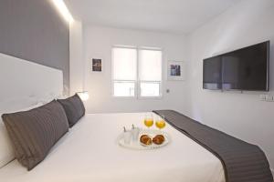 TV a/nebo společenská místnost v ubytování Gran Via Suites