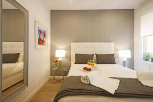 Postel nebo postele na pokoji v ubytování Sofia Suites