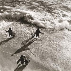 two men walking on the beach with their surfboards at Beach House - Between Porto and Viana do Castelo in Esposende