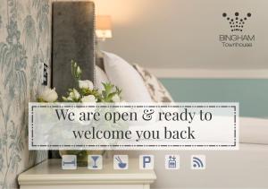 a sign that says we are open and ready to welcome you back at The Bingham Townhouse in Bingham