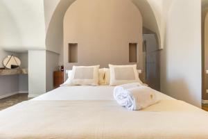 Postel nebo postele na pokoji v ubytování Palazzo Mascetti + 37 fotografií