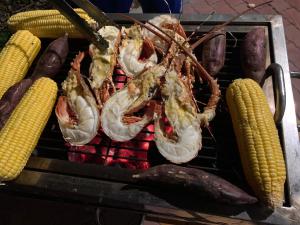 a group of shrimp and corn on a grill at Bella Vista Vung Tau in Vung Tau