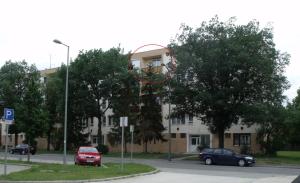 a basketball hoop in front of a building at Acceptus Domus in Szombathely +9 photos