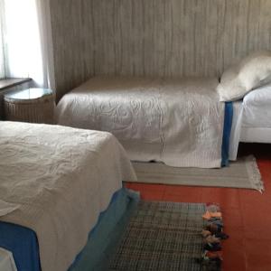 Postel nebo postele na pokoji v ubytování L'Orchidée
