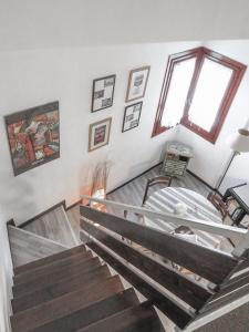 a room with stairs and a window at La Casetta in Montagna in Pietracamela