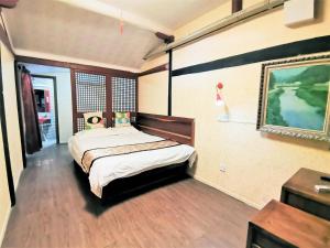 Postel nebo postele na pokoji v ubytování Shaoxing Laotaimen Luxun Native Place Youth Hostel