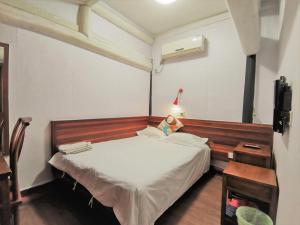 Postel nebo postele na pokoji v ubytování Shaoxing Laotaimen Luxun Native Place Youth Hostel