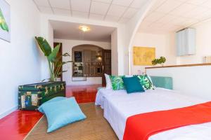 A bed or beds in a room at The Palm