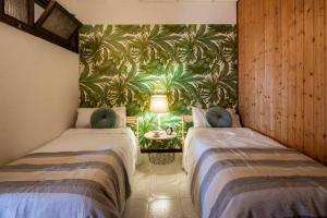A bed or beds in a room at The Palm