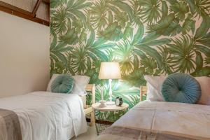 A bed or beds in a room at The Palm