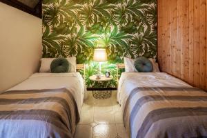 A bed or beds in a room at The Palm