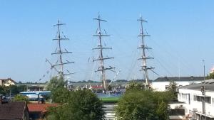 two tall ships are docked in a harbor at Alte Bürger in Bremerhaven