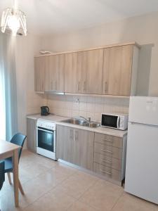 A kitchen or kitchenette at Green Island Residence