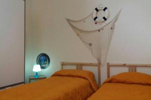 Postel nebo postele na pokoji v ubytování Onda Mare