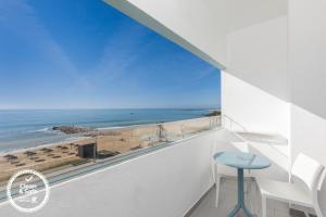 a balcony with a view of the beach at Dom Jose Beach Hotel (Plus) in Quarteira