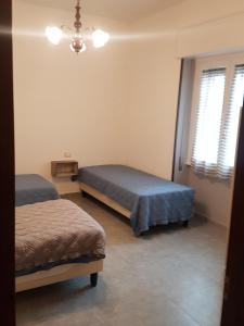 Postel nebo postele na pokoji v ubytování B&B Confine