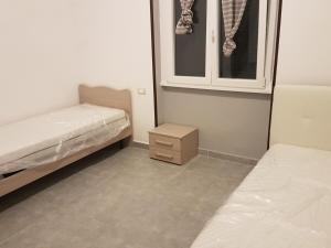 Postel nebo postele na pokoji v ubytování B&B Confine
