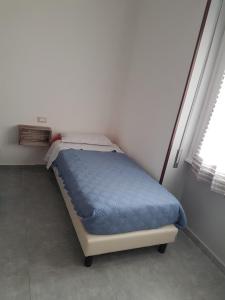 Postel nebo postele na pokoji v ubytování B&B Confine